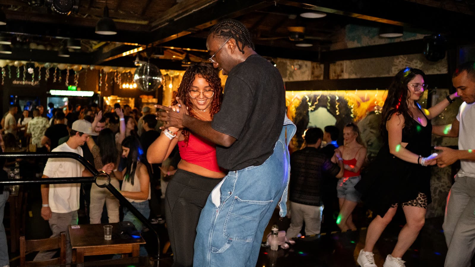 A couple dancing bachata closely